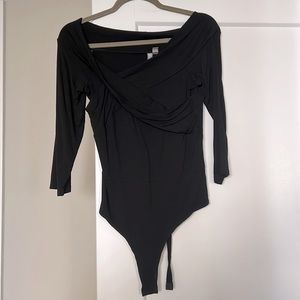 Asymmetrical black bodysuit